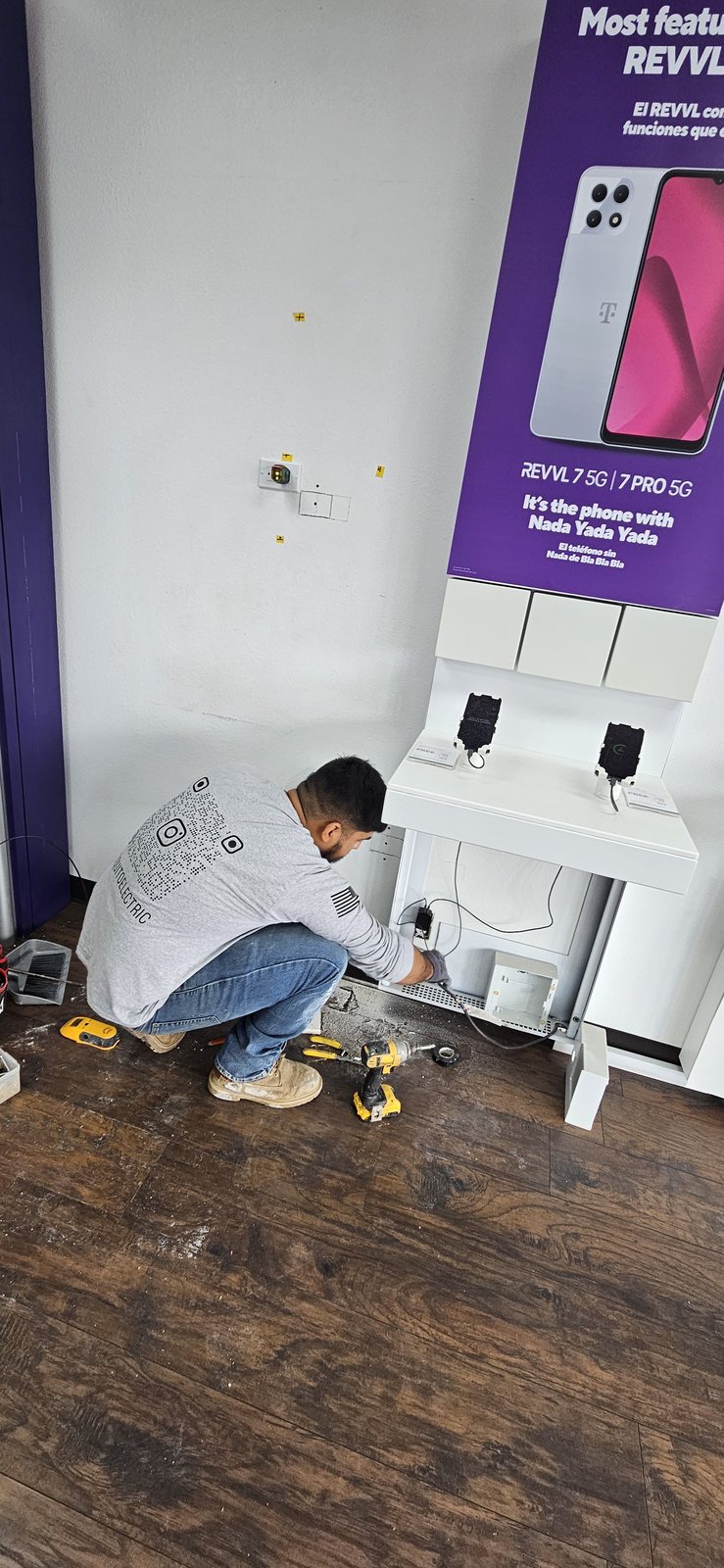 Foquito Electric completing electrical work inside a retail space