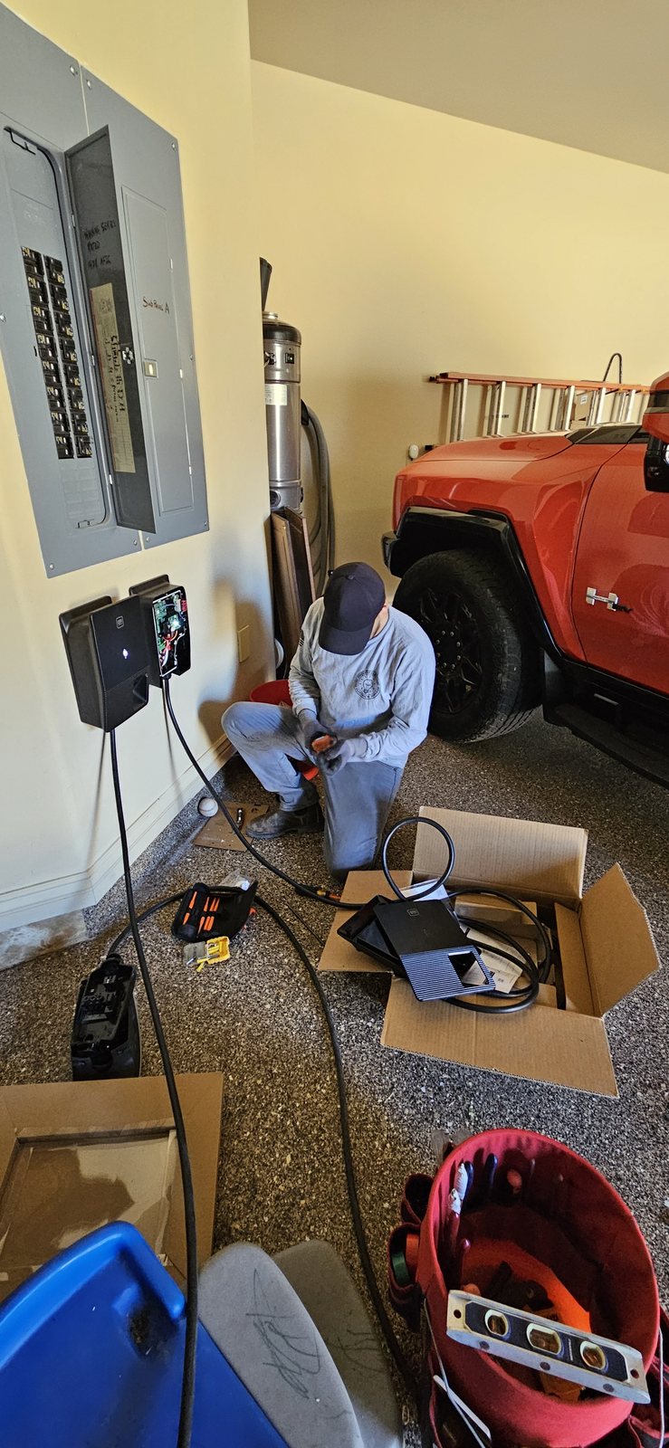 Foquito Electric installing a residential electric vehicle charger